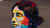 A portrait of Helen Keller made from arranged clothing [donated by Dusty Rose Vintage] 2017