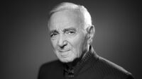 French-Armenian singer Charles Aznavour poses during a photo session in Paris, on November 16, 2017. / AFP PHOTO / JOEL SAGET