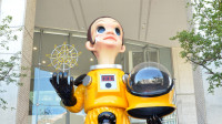This handout from the Fukushima City public information division taken on August 3, 2018 and received on August 14 shows the artwork entitled "Sun Child" by artist Kenji Yanobe at an unveiling ceremony in Fukushima.
"Sun Child", a giant statue of a child wearing a radiation suit in the nuclear-hit Japanese city of Fukushima, has touched off a storm of criticism online as the area seeks to recover its reputation. / AFP PHOTO / Fukushima City Public Information Division / Handout / -----EDITORS NOTE --- RESTRICTED TO EDITORIAL USE - MANDATORY CREDIT "AFP PHOTO / FUKUSHIMA CITY PUBLIC INFORMATION DIVISION" - NO MARKETING - NO ADVERTISING CAMPAIGNS - DISTRIBUTED AS A SERVICE TO CLIENTS - NO ARCHIVES - MANDATORY MENTION OF THE ARTIST UPON PUBLICATION - TO ILLUSTRATE THE EVENT AS SPECIFIED IN THE CAPTION /