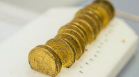 This handout picture released by the University Lumiere Lyon II on November 14, 2017, shows golden dinar coins on September 21, 2017, in Cluny, central France. 
Scientists from the University of Lyon II and the French National Centre for Scientific Research (CNRS) found a medieval treasure of over 2,000 coins from the 12th century as they were probing an angle of the former Cluny Abbey. / AFP PHOTO / University Lumiere Lyon II / Alexis GRATTIER / RESTRICTED TO EDITORIAL USE - MANDATORY CREDIT "AFP PHOTO / UNIVERSITY LUMIERE LYON II / ALEXIS GRATTIER" - NO MARKETING NO ADVERTISING CAMPAIGNS - DISTRIBUTED AS A SERVICE TO CLIENTS