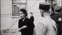 Lodz ghetto: Ghetto police with woman behind barbed wire
	Henryk Ross (Polish, born in 1910-1991)
		1942
	Gelatin silver print.
	*Art Gallery of Ontario. Gift from the Archive of Modern Conflict, 2007.
	*© Art Gallery of Ontario
	*Courtesy Museum of Fine Arts, Boston
		*Reproduced with permission