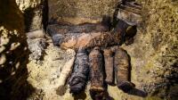 This picture taken on February 2, 2019 shows newly-discovered mummies wrapped in linen found in burial chambers dating to the Ptolemaic era (305-30 BC) at the necropolis of Tuna el-Gebel in Egypt's southern Minya province, about 340 kilometres south of the capital Cairo. - Egypt's Antiquities Minister said on February 2 that a joint mission from the ministry and Minya University's Archaeological Studies Research Centre found upon a collection of Ptolemaic burial chambers engraved in rock and filled with a large number of mummies of different sizes and genders. The minister added that the newly discovered tombs may be a familial grave for a family from the elite middle class. (Photo by MOHAMED EL-SHAHED / AFP)