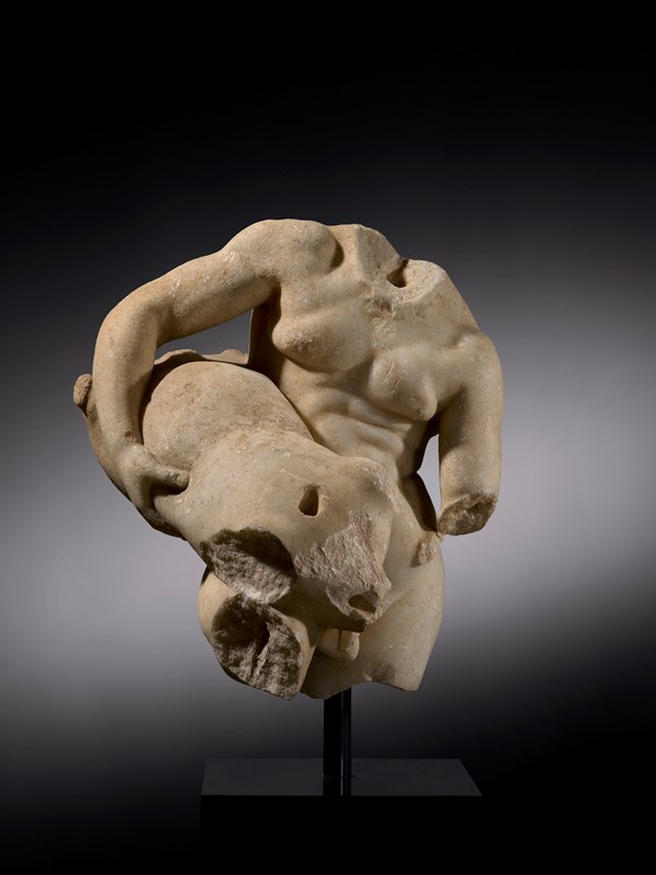 Torso of the drunken Silenus holding a wineskin for serving, marble, roman, 1st century AD, Gallery Desmet, BRAFA Art Fair