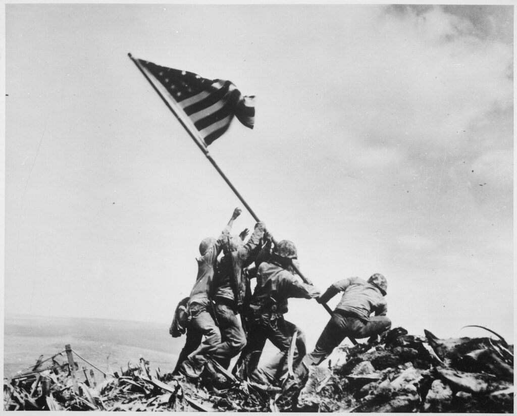 Joe Rosenthal, U.S. Marines of the 28th Regiment, 5th Division, raise the American flag atop Mt. Suribachi, Iwo Jima, 1945