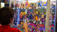 PARIS, FRANCE - 2017/10/01: A man is pictured while looking at manga characters figurine during the 24th edition of the Paris Manga Sci-Fi Show mostly devoted to Japanese entertainment and modern pop culture. The event will runs from September 30 to October 01, 2017 at Porte de Versailles, promoting manga, video games and anime. (Photo by Nicolas Briquet/SOPA Images/LightRocket via Getty Images)