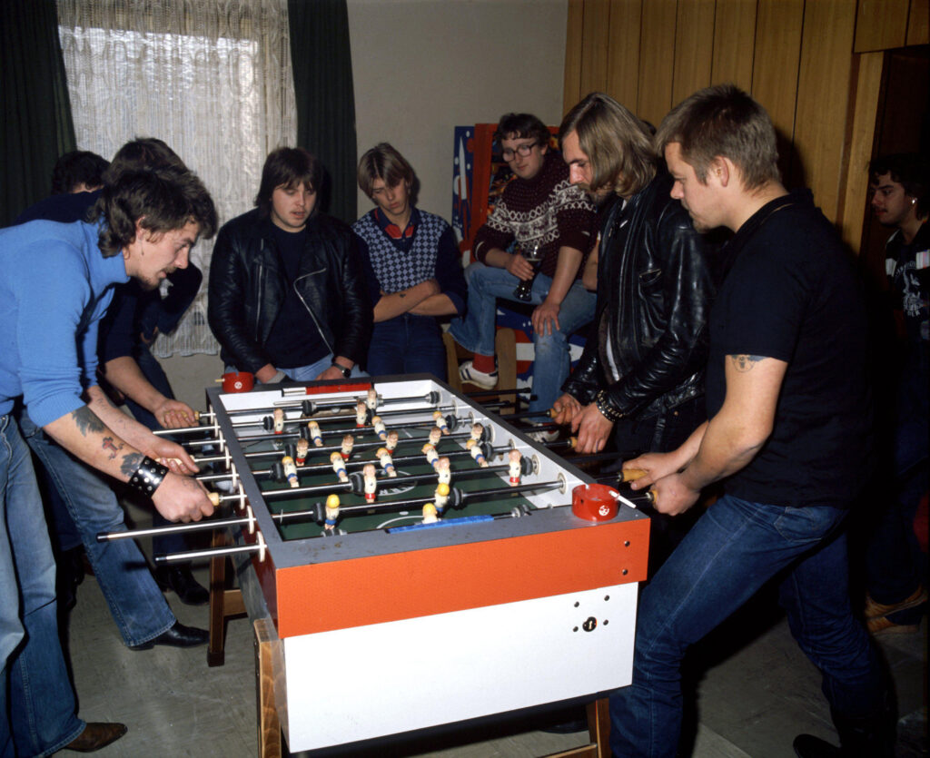 Young men play table football in a bar (1982) Young men play table football in a bar (1982)