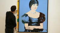 An art handler prepares an Andy Warhol portrait of Princess Diana created in 1982, as it is displayed at Phillips auction rooms in London, Thursday, Feb. 29, 2024. The painting estimated at 1,200,00 - 1,800,00 UK Pounds (1,520,000 - 2,280,000 US Dollars) will be for auction in the London 20th Century and Contemporary Art Sales on March 7 and 8. (AP Photo/Kirsty Wigglesworth)/LKW104/24060458880129//2402291350