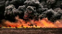 Al Ahmadi, Kuwait, 1991, KUWAIT-10001.

CAPTION: Camels and Oil Fields. Al Ahmadi, Kuwait, 1991.
